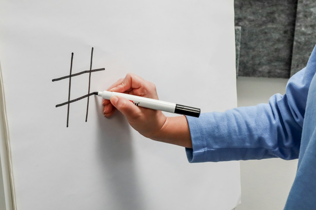 A close-up shot of hands drawing lines and connecting ideas on a clean, minimal whiteboard, illustrating the concept of strategic planning and connecting data points for greater impact.